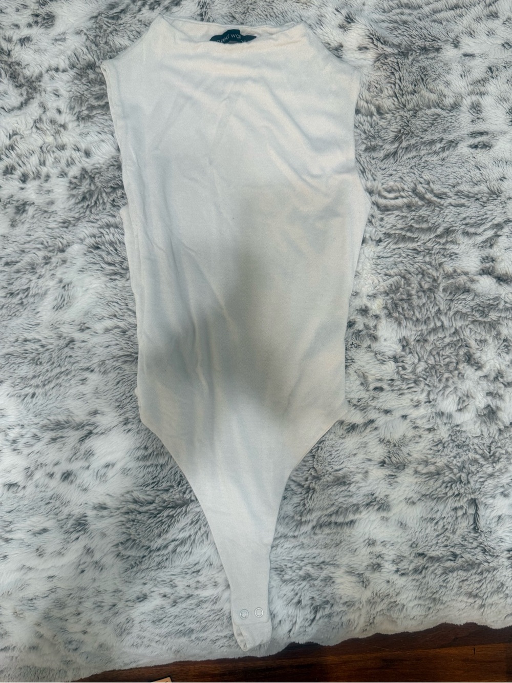 naked wardrobe White Sleeveless Ribbed Bodysuit (missing button)